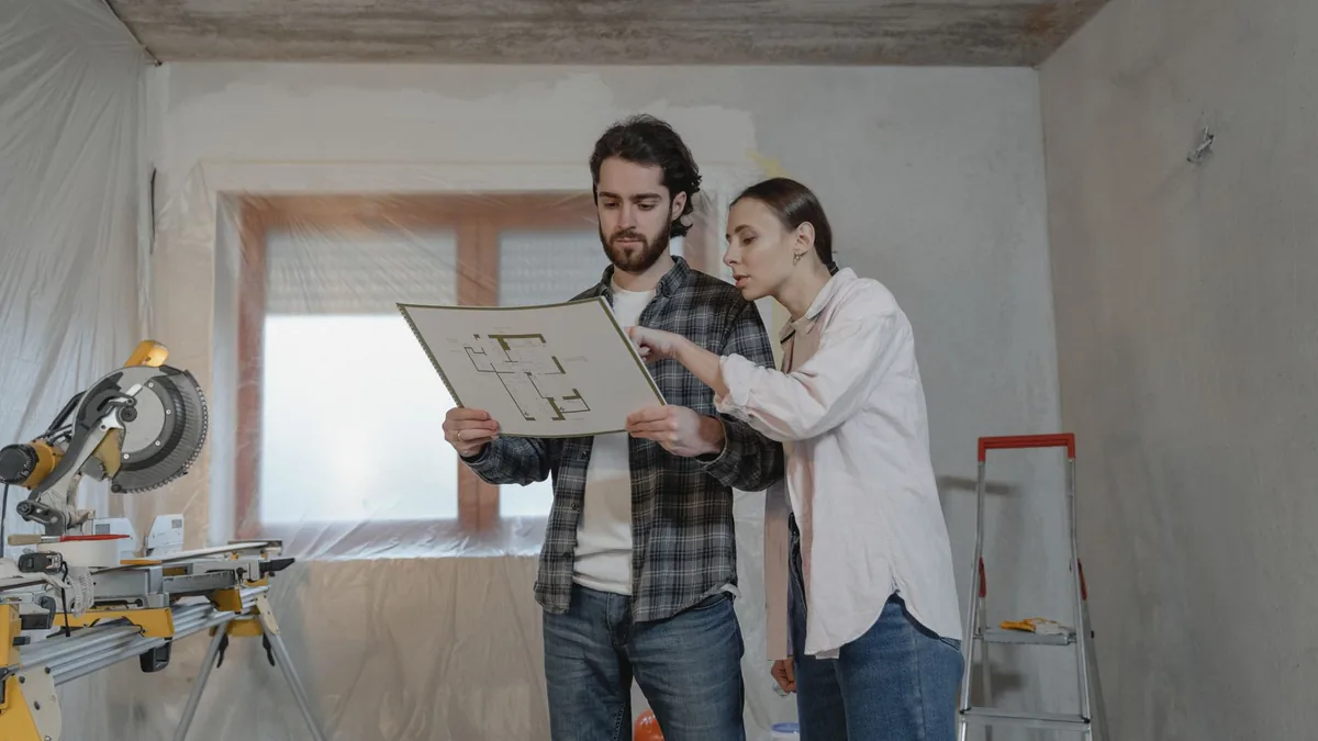 Designer reviewing kitchen plans with an Anaheim, CA homeowner